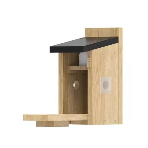 Wooden birdhouse with a black roof on a white background